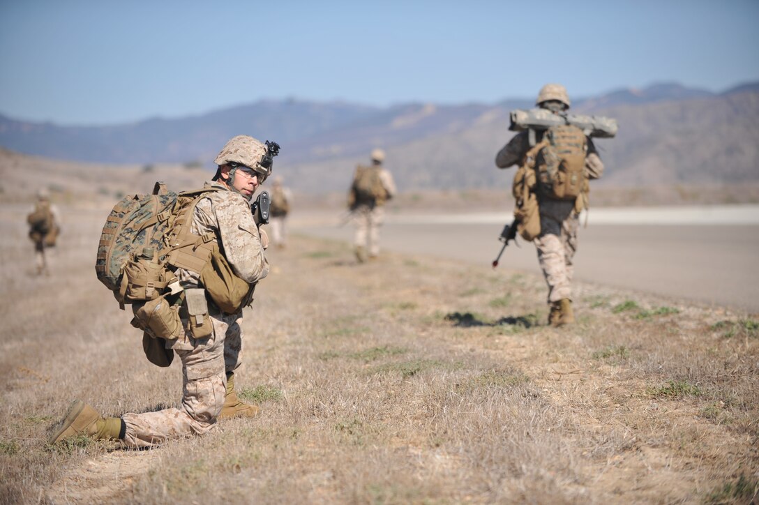 Marines serving with the 11th Marine Expeditionary Unit's Battalion Landing Team 3/1 practice patrolling during a raid exercise here Oct. 11. The unit embarked USS Makin Island, USS New Orleans and USS Pearl Harbor Sept. 28 to participate in a final training exercise before deploying in November.